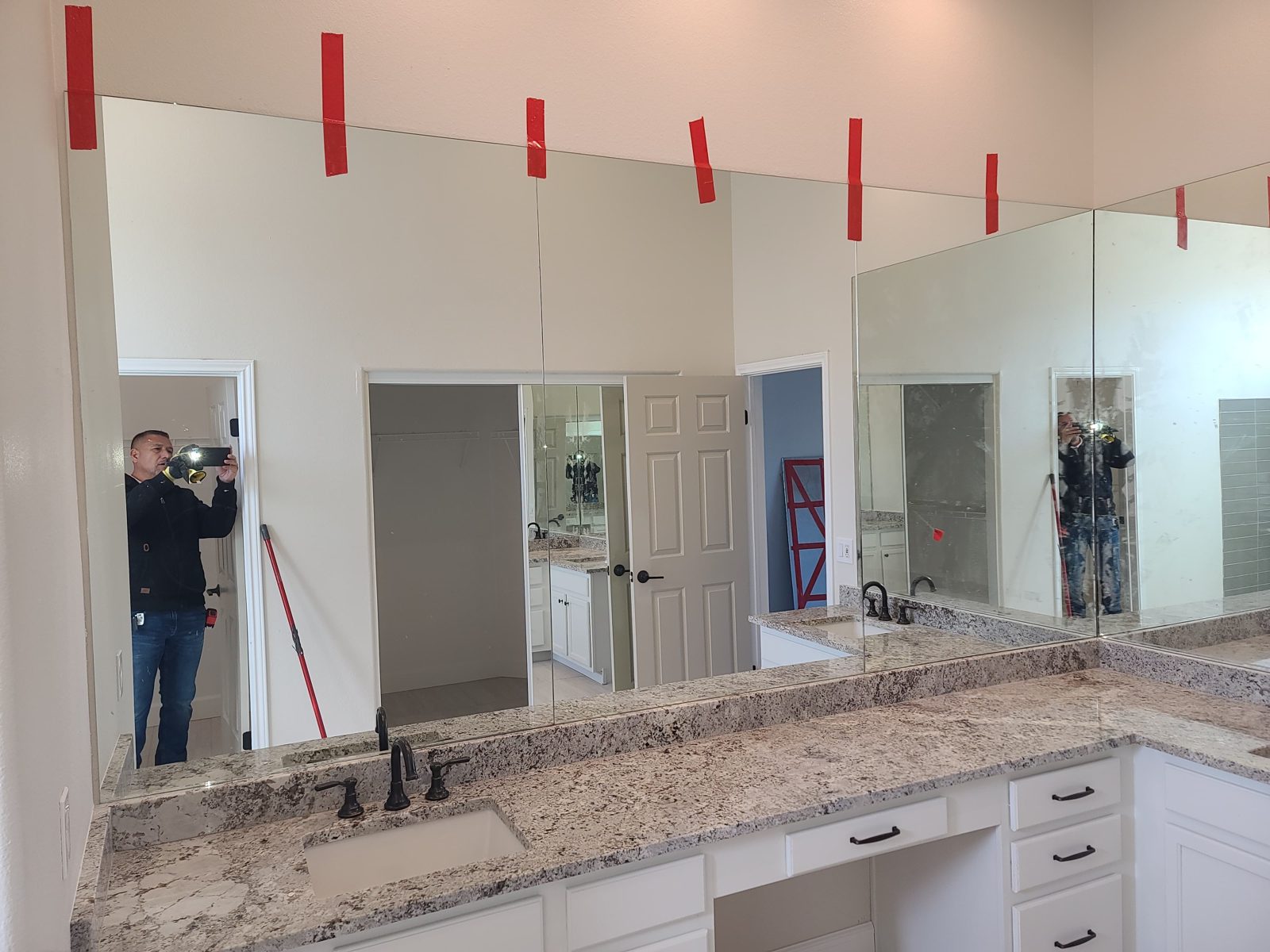 Large frameless vanity mirror with dual sinks, residential bathroom by Mad Touch Glass