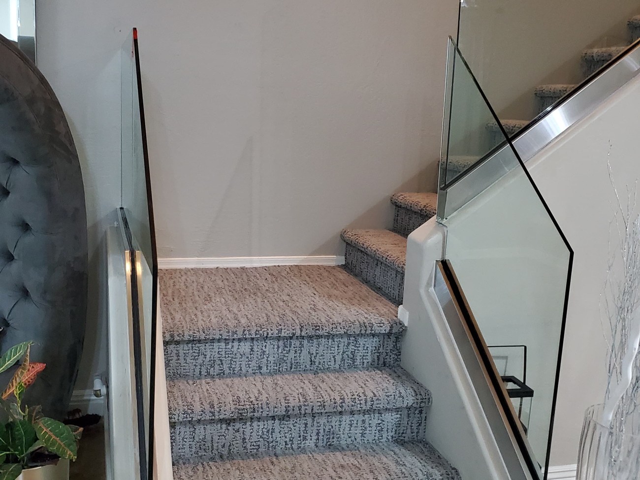 Frameless glass stair railing on a carpeted staircase, Phoenix-area home by Mad Touch Glass